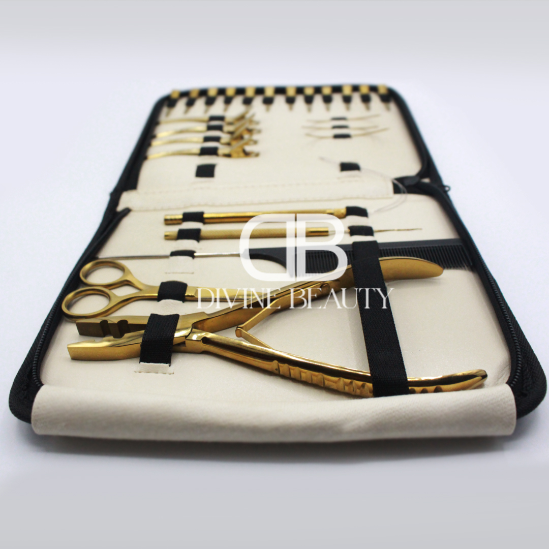 Luxury gold titanium hair extension tool kit featuring extension pliers, sectioning clips, threading needles, loop tools, scissors, comb, and professional salon accessories in a zippered carrying case.